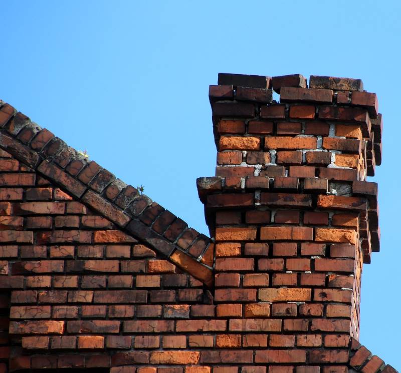 Signs Your Silver Spring Home Needs a Chimney Inspection Damaged chimney on an Silver Spring home showing cracks and missing mortar